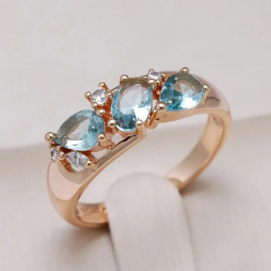 Kira | Gold ring with blue zirconia